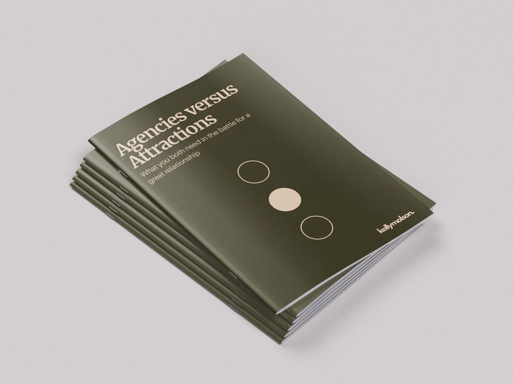 Printed copies of the Agencies versus Attractions report stacked on top of each other.